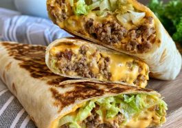 Big Mac wrap filled with beef, lettuce, cheese, pickles, and burger sauce.