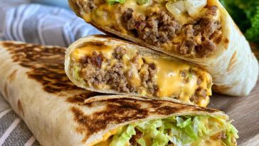 Big Mac wrap filled with beef, lettuce, cheese, pickles, and burger sauce.
