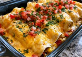 Chicken enchiladas covered in creamy queso sauce, cheesy and baked.