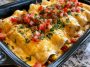 Chicken enchiladas covered in creamy queso sauce, cheesy and baked.