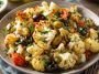 Marinated cauliflower salad with fresh vegetables and Mediterranean herbs.