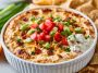 Creamy viral boat dip made with Rotel, ranch seasoning, and cheese, served in a bowl with chips for dipping.