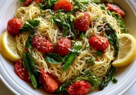 A bright and refreshing Lemon Capellini Salad with thin pasta, fresh herbs, and zesty lemon dressing served in a rustic bowl.