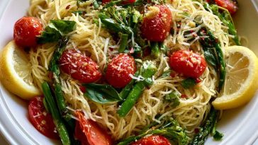 A bright and refreshing Lemon Capellini Salad with thin pasta, fresh herbs, and zesty lemon dressing served in a rustic bowl.