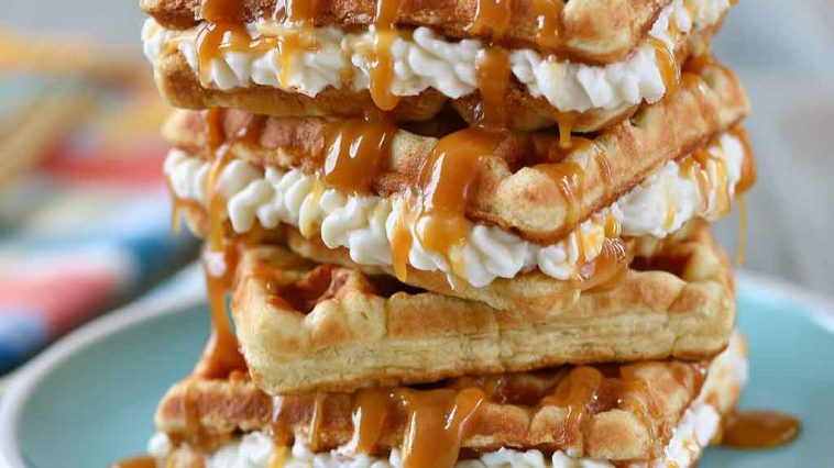 Caramel cream waffle sandwiches made with fluffy waffles filled with whipped cream and drizzled with rich caramel sauce.