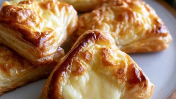 Mini cheese danishes with flaky pastry and creamy cheese filling.