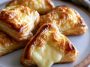 Mini cheese danishes with flaky pastry and creamy cheese filling.