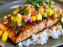 Salmon fillet glazed with mango teriyaki sauce served with rice and vegetables
