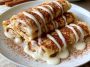 Thin crepes with cinnamon filling and protein-rich ingredients, soft and rolled.