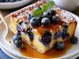 Blueberry buttermilk pancake casserole baked golden with fresh blueberries on top.
