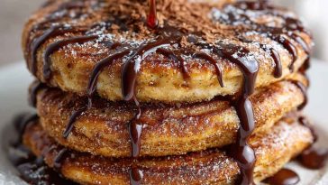 Fluffy pancakes coated in cinnamon sugar, inspired by Spanish churros.