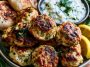 Chicken kofta served with creamy garlic yogurt sauce and herbs.