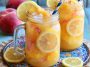 Refreshing beach peach lemonade with fresh peaches and lemon slices in a chilled glass with ice.
