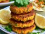 Golden coconut curry carrot and chickpea patties served crispy with herbs and a creamy dipping sauce.