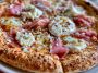 Gourmet prosciutto honey burrata pizza topped with creamy burrata cheese, thin prosciutto slices, fresh herbs, and a drizzle of honey.