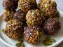 Chocolate bites topped with crunchy pumpkin seeds, rich and bite-sized.