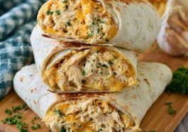 Cheesy garlic chicken wraps with crispy tortillas and melted cheese.