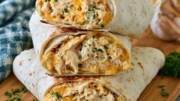 Cheesy garlic chicken wraps with crispy tortillas and melted cheese.