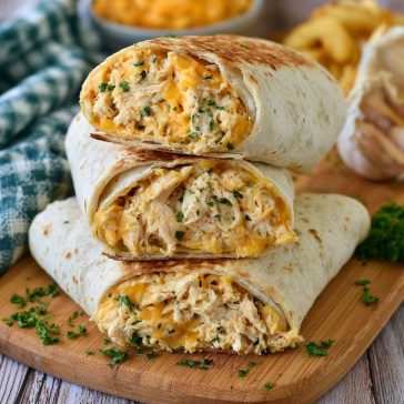 Cheesy garlic chicken wraps with crispy tortillas and melted cheese.