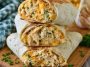 Cheesy garlic chicken wraps with crispy tortillas and melted cheese.