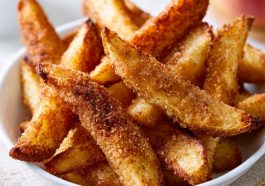 Crispy air fryer apple fries coated with cinnamon sugar and served warm.
