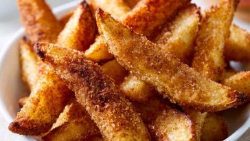 Crispy air fryer apple fries coated with cinnamon sugar and served warm.