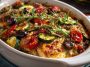 Baked chicken with zucchini, herbs, and Mediterranean flavors in a casserole dish.