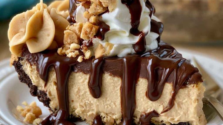 Chocolate peanut butter pie with a creamy peanut butter filling and rich chocolate topping, served in a slice with whipped cream.