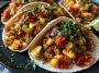 Sheet pan chicken tacos with chipotle seasoning, roasted pineapple, and fresh toppings served in warm tortillas.