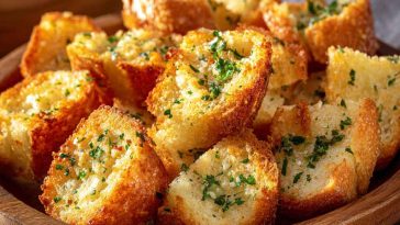 Ritz Bits crackers coated in garlic butter seasoning, crispy and golden.