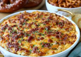 Creamy cheesy pretzel dip served with soft pretzels for dipping.