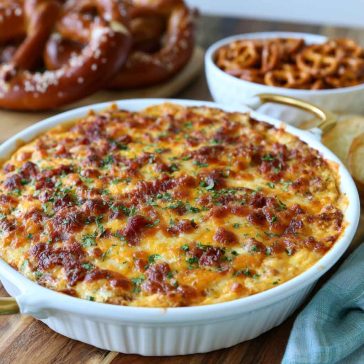 Creamy cheesy pretzel dip served with soft pretzels for dipping.