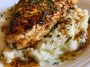 Juicy glazed garlic herb chicken breast served over creamy mashed potatoes with rich pan sauce drizzled on top.