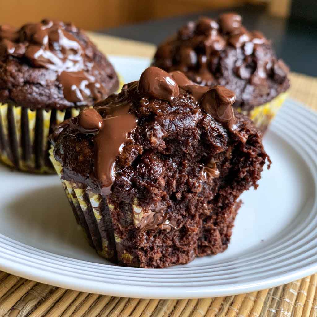 Double chocolate muffins with chocolate chips, rich and moist texture.
