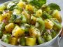 Fresh pineapple kiwi salad with juicy pineapple chunks, sliced kiwi, mint leaves, and a light citrus dressing.