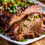 Tender slow cooker beef brisket with rich sauce, made with simple ingredients.
