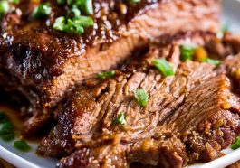 Tender slow cooker beef brisket with rich sauce, made with simple ingredients.