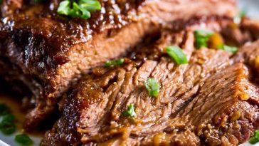 Tender slow cooker beef brisket with rich sauce, made with simple ingredients.
