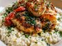 Chicken scampi served over creamy garlic Parmesan rice with herbs.