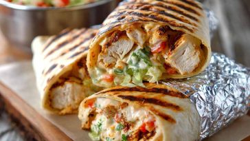 Grilled chicken burrito filled with chipotle ranch sauce, rice, and fresh toppings.