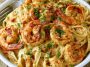 Creamy Cajun shrimp and crab pasta with tender seafood, rich sauce, and perfectly cooked pasta, garnished with parsley.