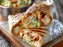 Grilled chicken burrito filled with chipotle ranch sauce, rice, and fresh toppings.
