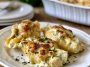 Garlic butter chicken Alfredo stuffed shells baked with creamy sauce and cheese.