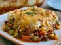Easy hobo casserole with ground beef, sliced potatoes, melted cheese, and a creamy sauce baked until golden and bubbly.