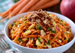 Fresh carrot apple salad made with shredded carrots, crisp apples, raisins, and a light creamy dressing.