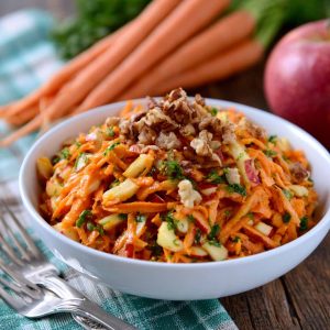 Fresh carrot apple salad made with shredded carrots, crisp apples, raisins, and a light creamy dressing.