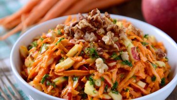 Fresh carrot apple salad made with shredded carrots, crisp apples, raisins, and a light creamy dressing.