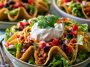 Healthy taco salad – Colorful salad bowl with beans, avocado, and tortilla chips.