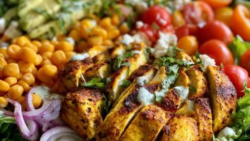 High protein chicken salad with Greek yogurt dressing – A bowl of shredded chicken, crisp vegetables, and creamy Greek yogurt dressing.