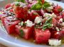“Bowl of watermelon feta salad with fresh mint and lime dressing, served as a colorful summer side dish.”